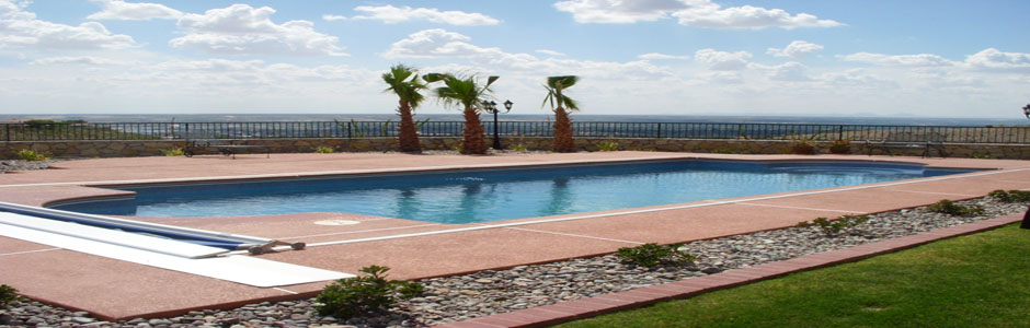 Swimming pool and terrace overlooking open water